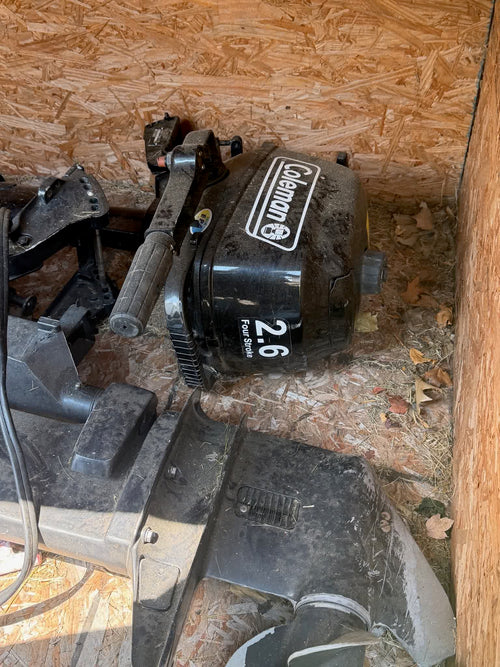 Coleman 2.6 outboard side view in storage shed