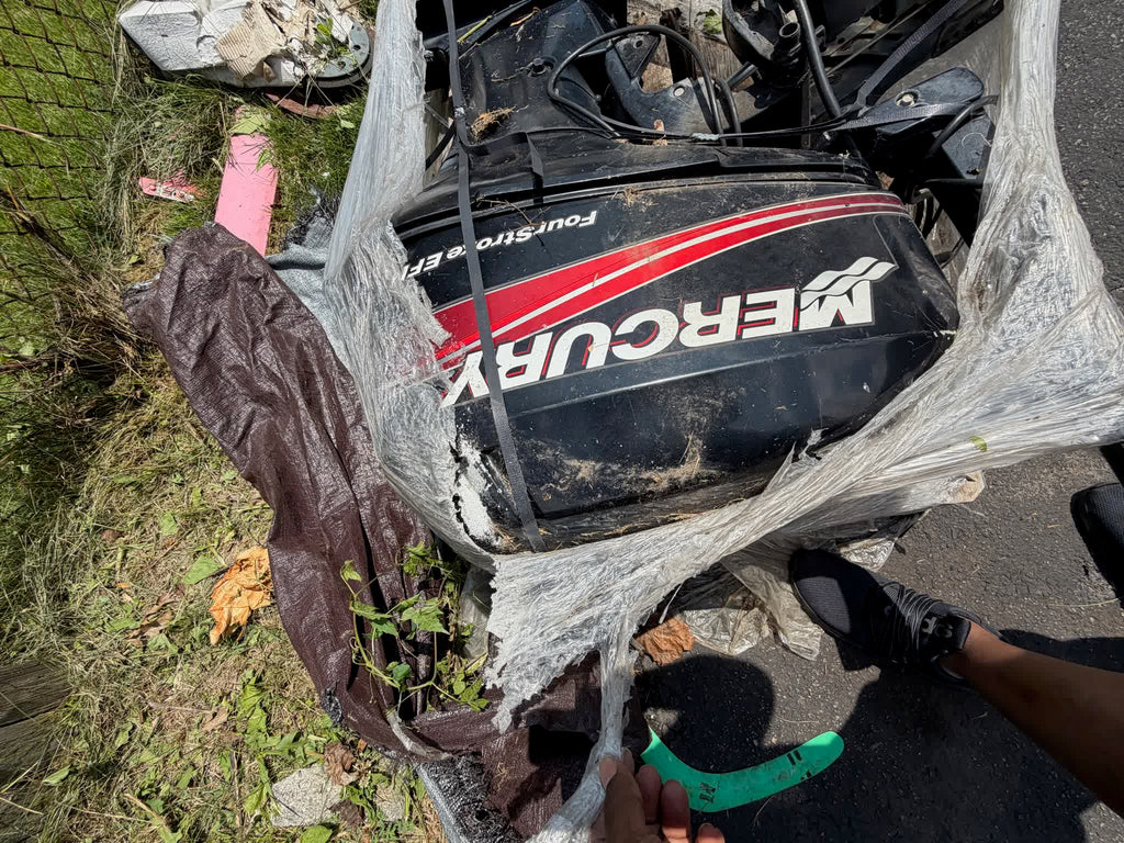 Mercury FourStroke EFI outboard shrink-wrapped on pallet, front view