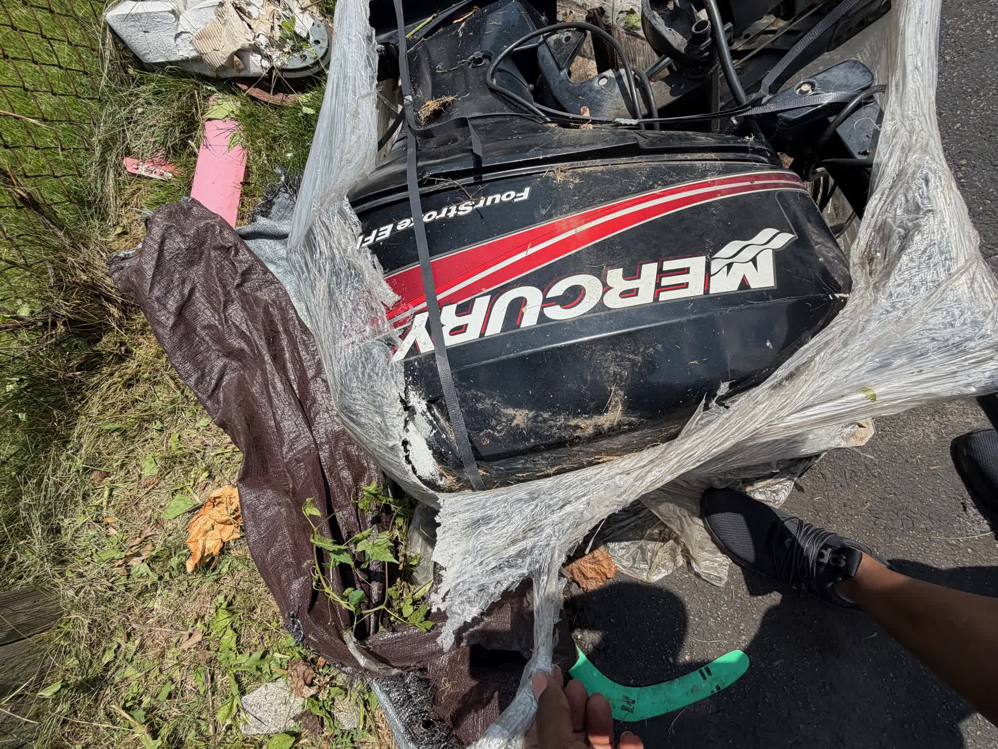 Mercury FourStroke EFI outboard shrink-wrapped on pallet, front view