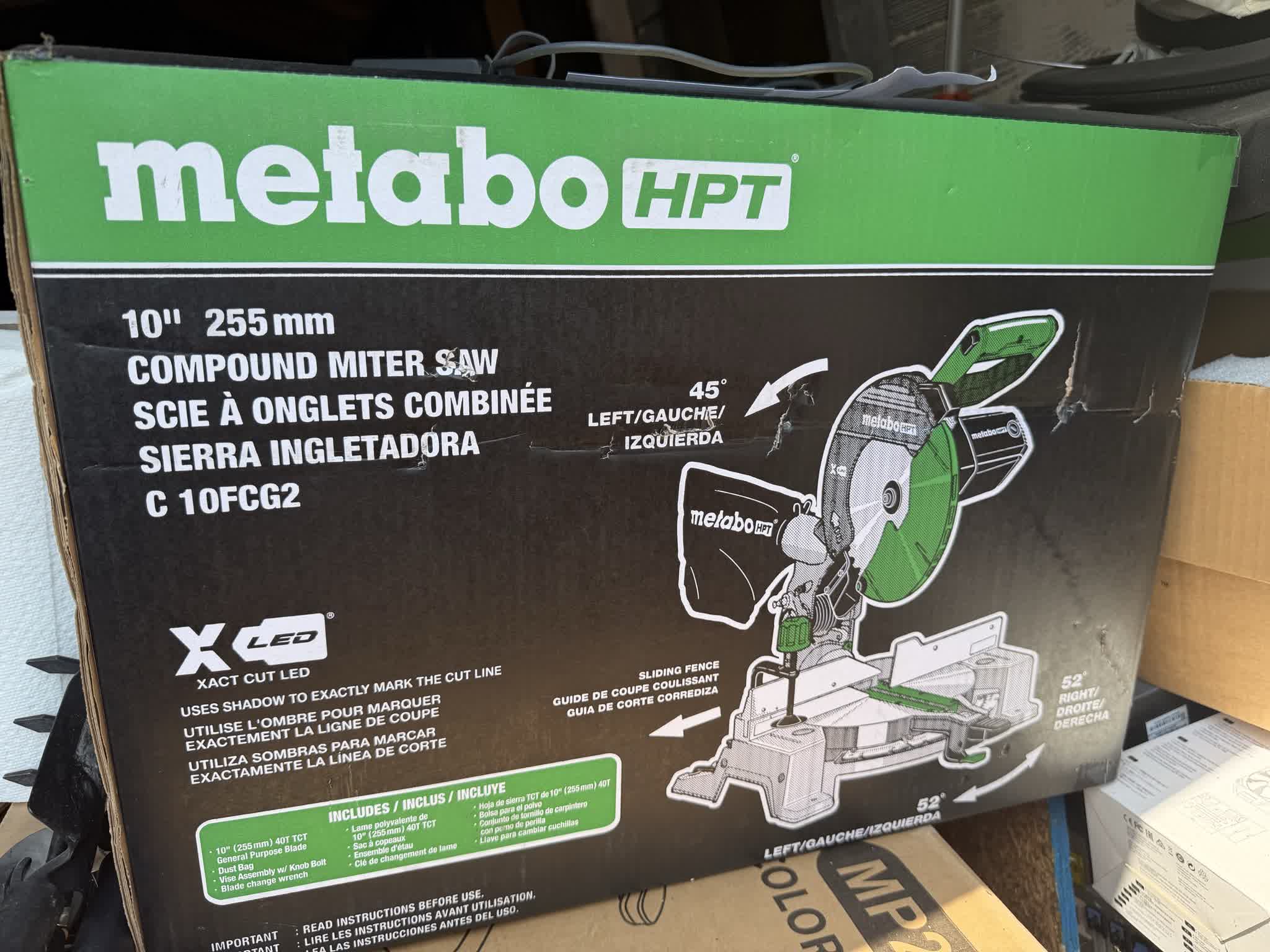 Metabo HPT C10FCG2 10-inch compound miter saw carton showing scuffs, punctures, and edge wear