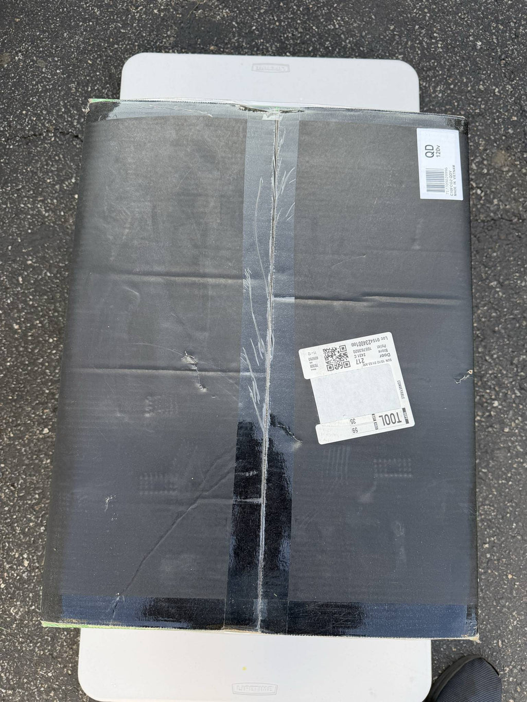 Metabo HPT miter saw carton top showing tape, shipping labels, dents, and creasing
