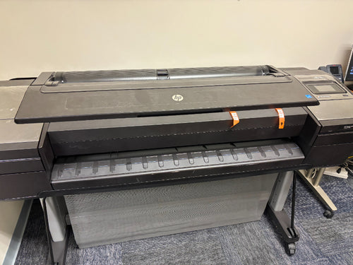 HP DesignJet Z6 44-inch large format printer on its rolling stand with mesh output catch basket, front view