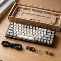Open-box compact mechanical keyboard with cable, puller, and spare switches